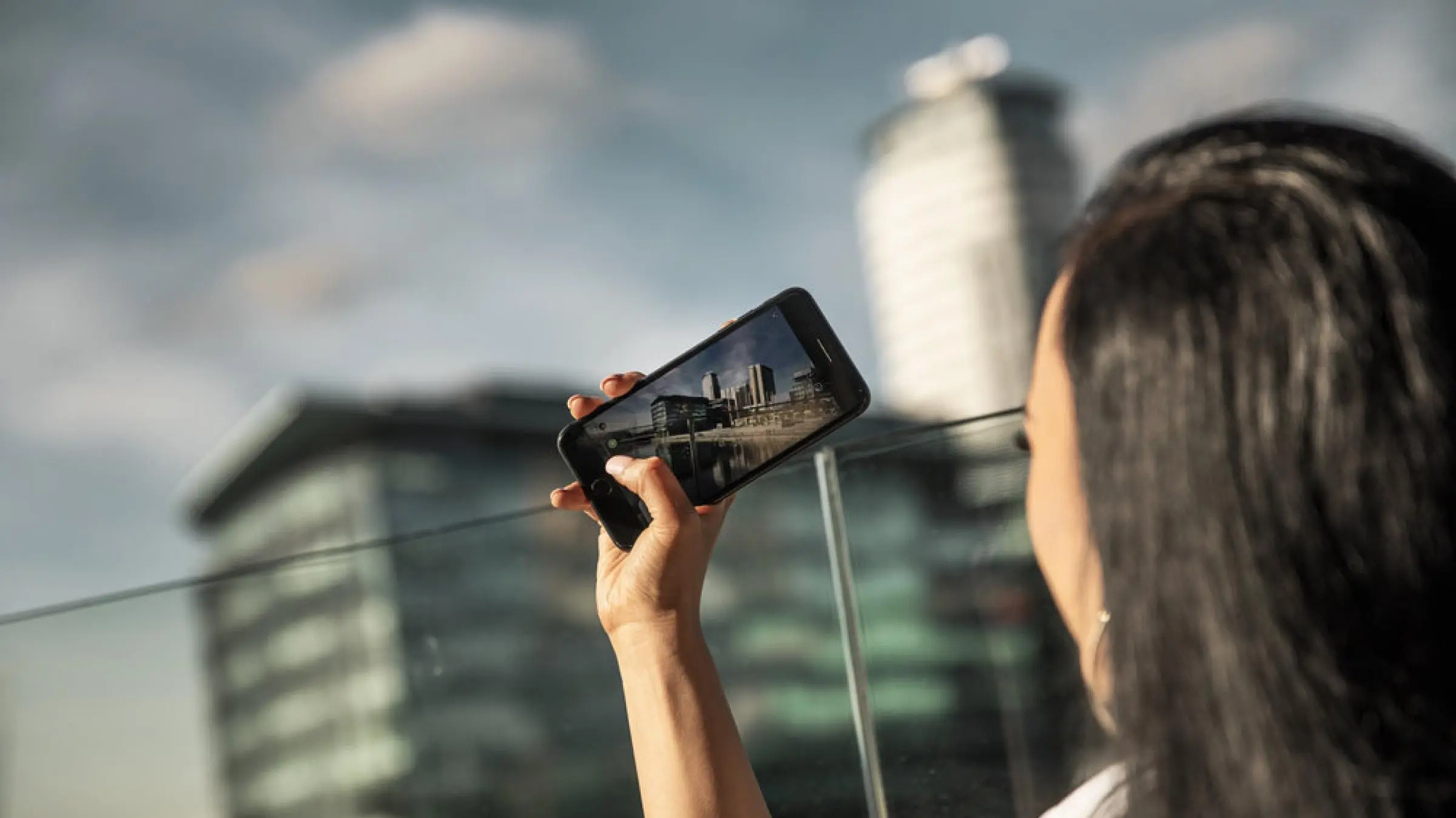 person taking photo on a mobile phone